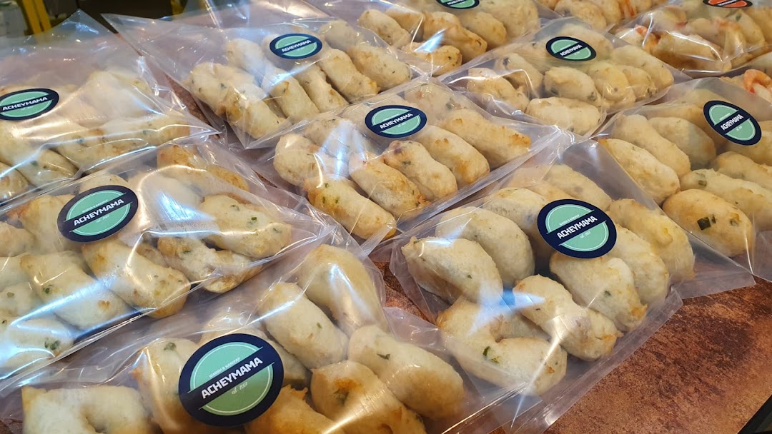 Rows of clear plastic bags filled with Acheymama's savory packaged snacks, ready for purchase.