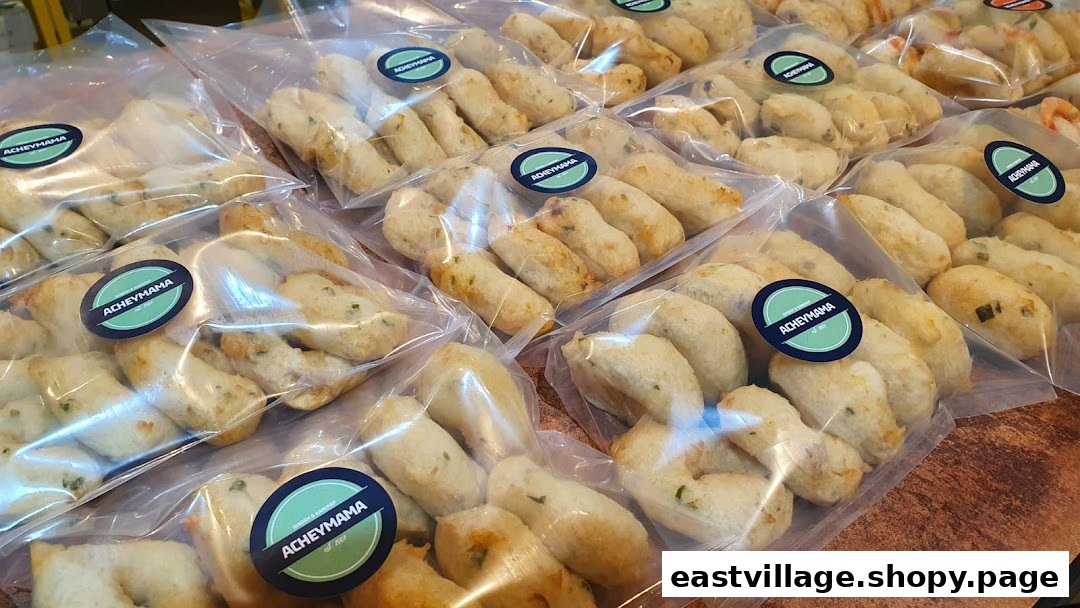 Rows of clear plastic bags filled with Acheymama's savory packaged snacks, ready for purchase.