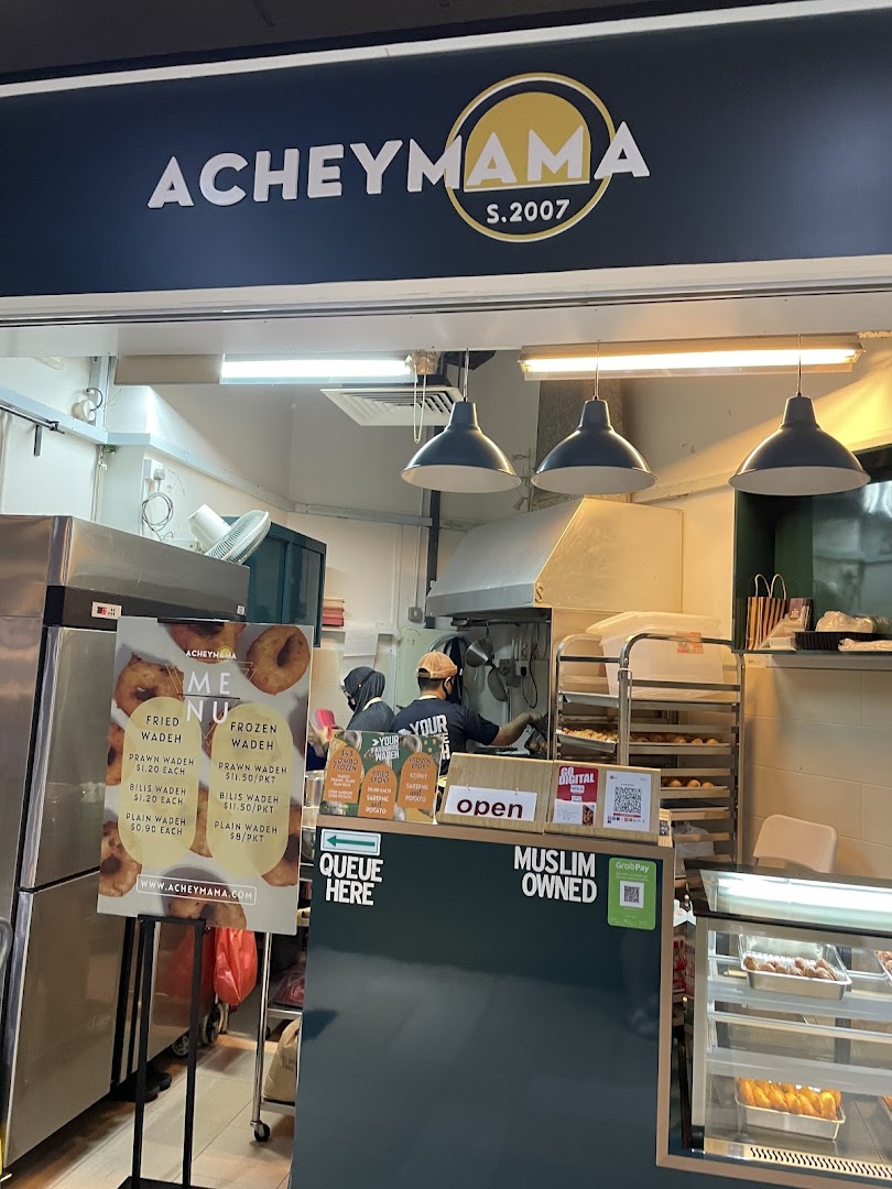 Acheymama shop front displaying its menu of fried and frozen wadeh.
