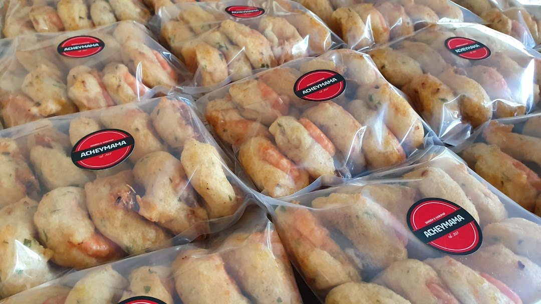 Multiple clear packages of Acheymama's fried snacks, some featuring shrimp, ready for purchase.