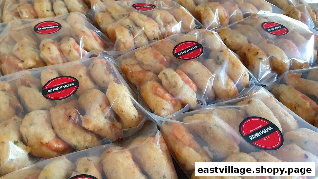 Multiple clear packages of Acheymama's fried snacks, some featuring shrimp, ready for purchase.