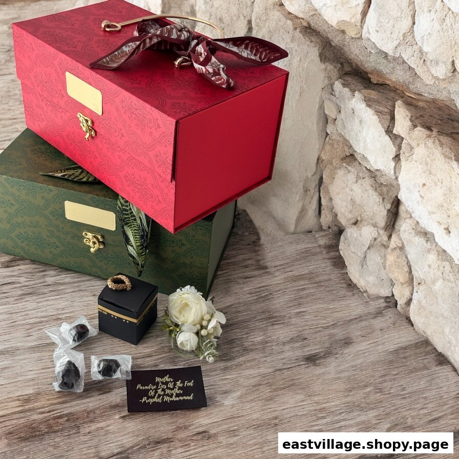 An elegant display of Islamic gifts featuring decorative boxes, dates, and a Kaaba-shaped item.