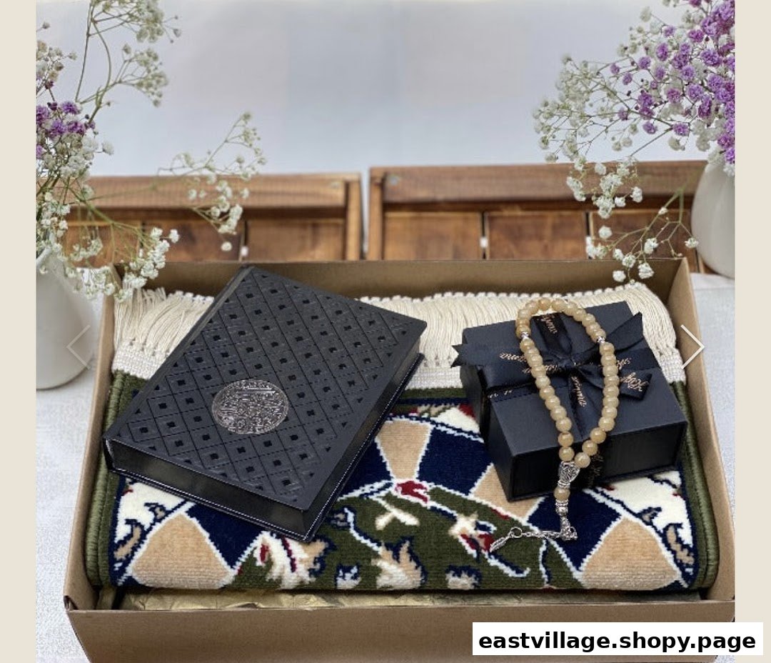 A beautifully presented Islamic gift set featuring a prayer mat, Quran, and prayer beads in a box.