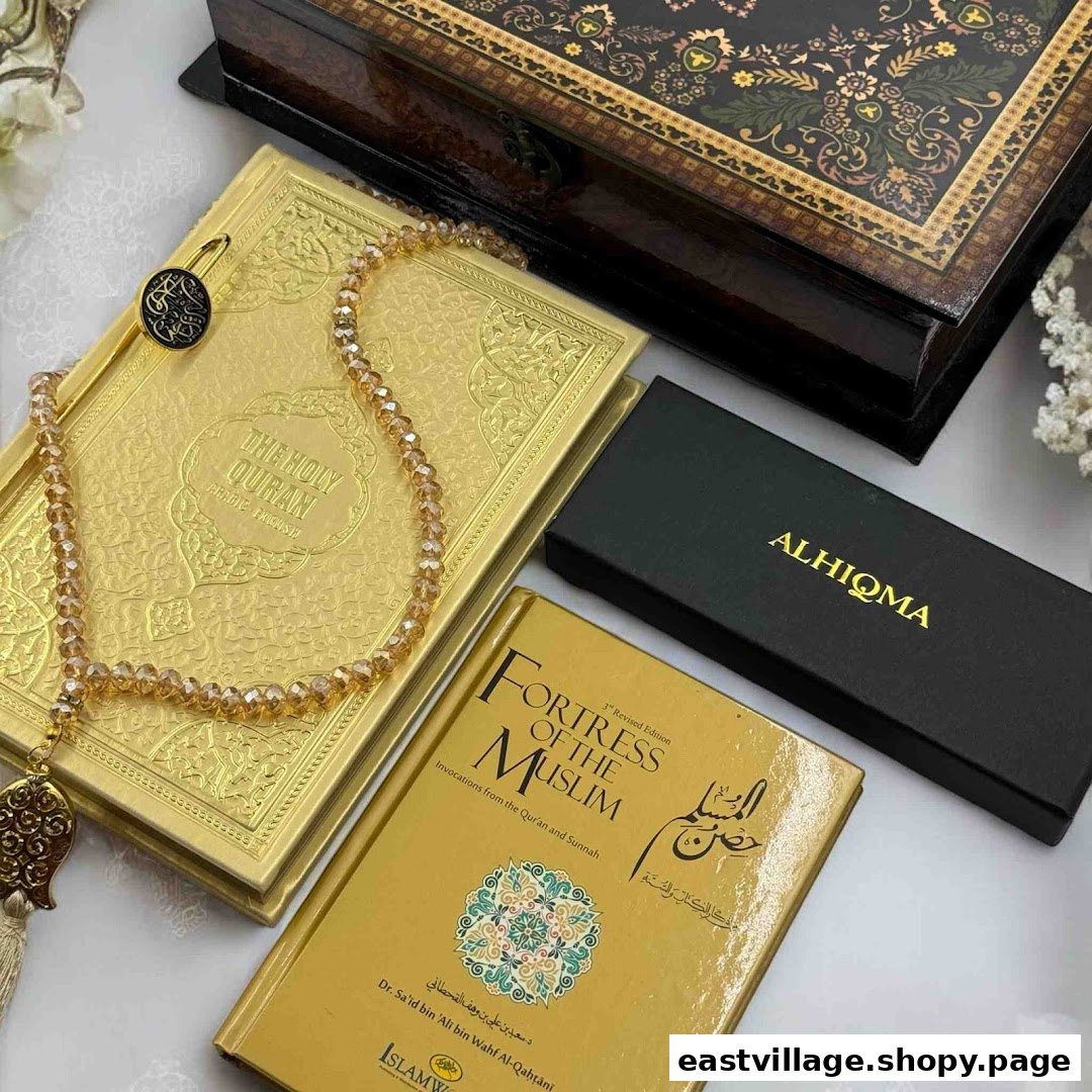 A collection of Islamic gifts including a golden Holy Quran, prayer beads, and an Islamic book.