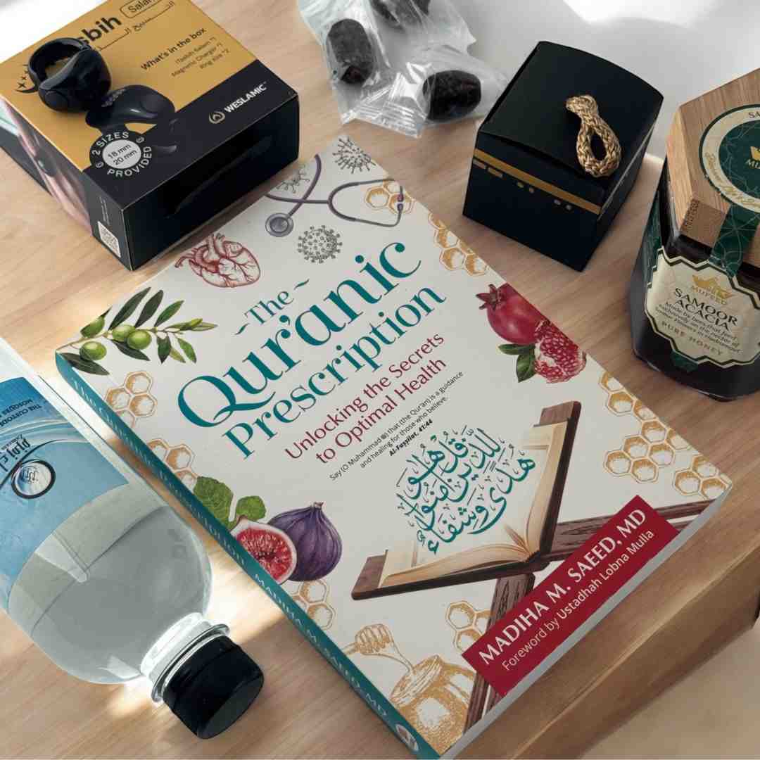 A flat lay of Islamic lifestyle products including a book, honey, dates, and a smart prayer ring.