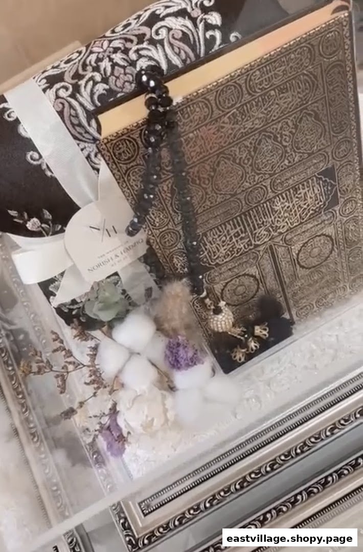 A beautifully presented Islamic gift set featuring a prayer mat, Quran, and prayer beads in an elegant box.