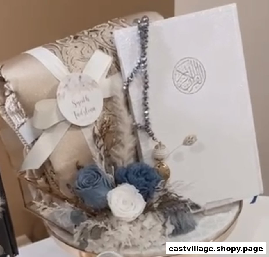 An elegant Islamic gift set featuring a white Quran, prayer mat, and decorative flowers.