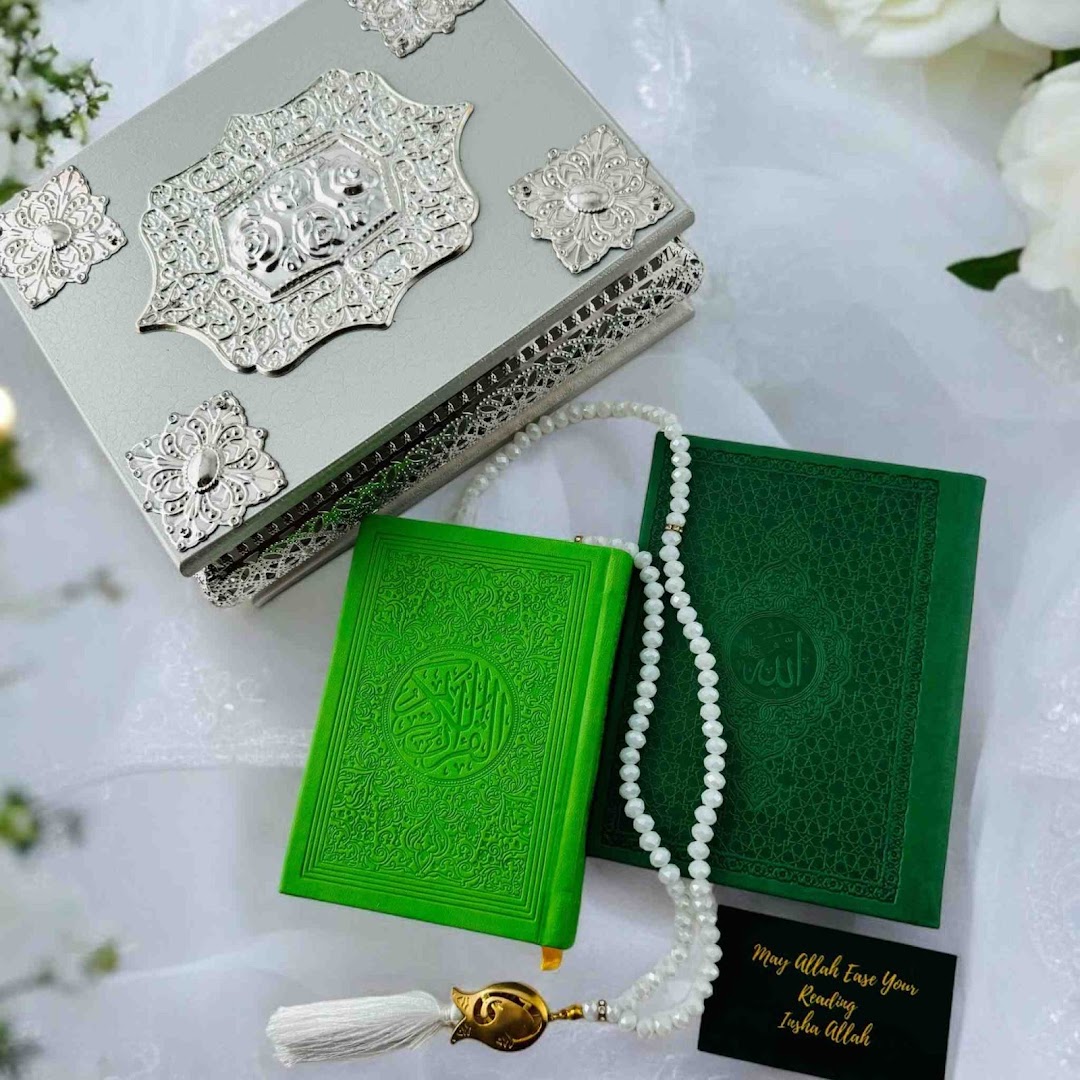 Elegant Islamic gift set featuring green Qurans, prayer beads, and a decorative silver box.