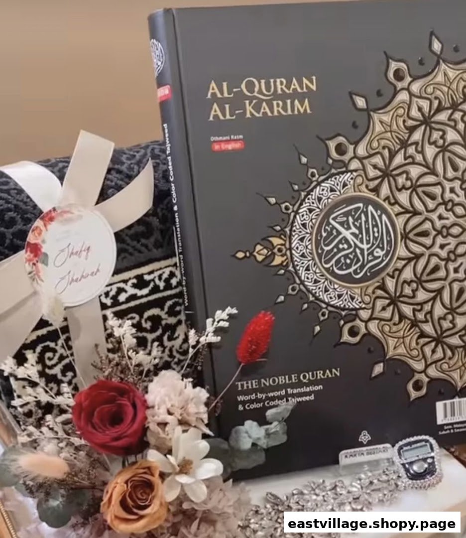 A beautifully arranged Islamic gift set featuring an Al-Quran, prayer mat, and decorative flowers.