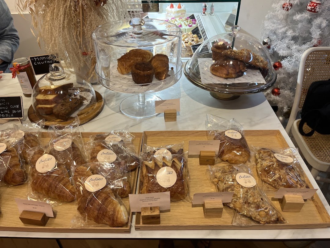 A vibrant display counter showcasing an array of freshly baked pastries, cakes, and other sweet treats.