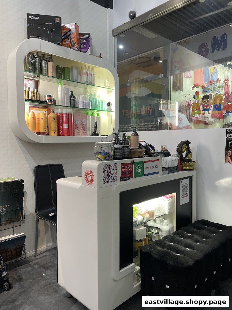 Interior view of Charisma Hair Studio showing product display, reception counter, and waiting area.