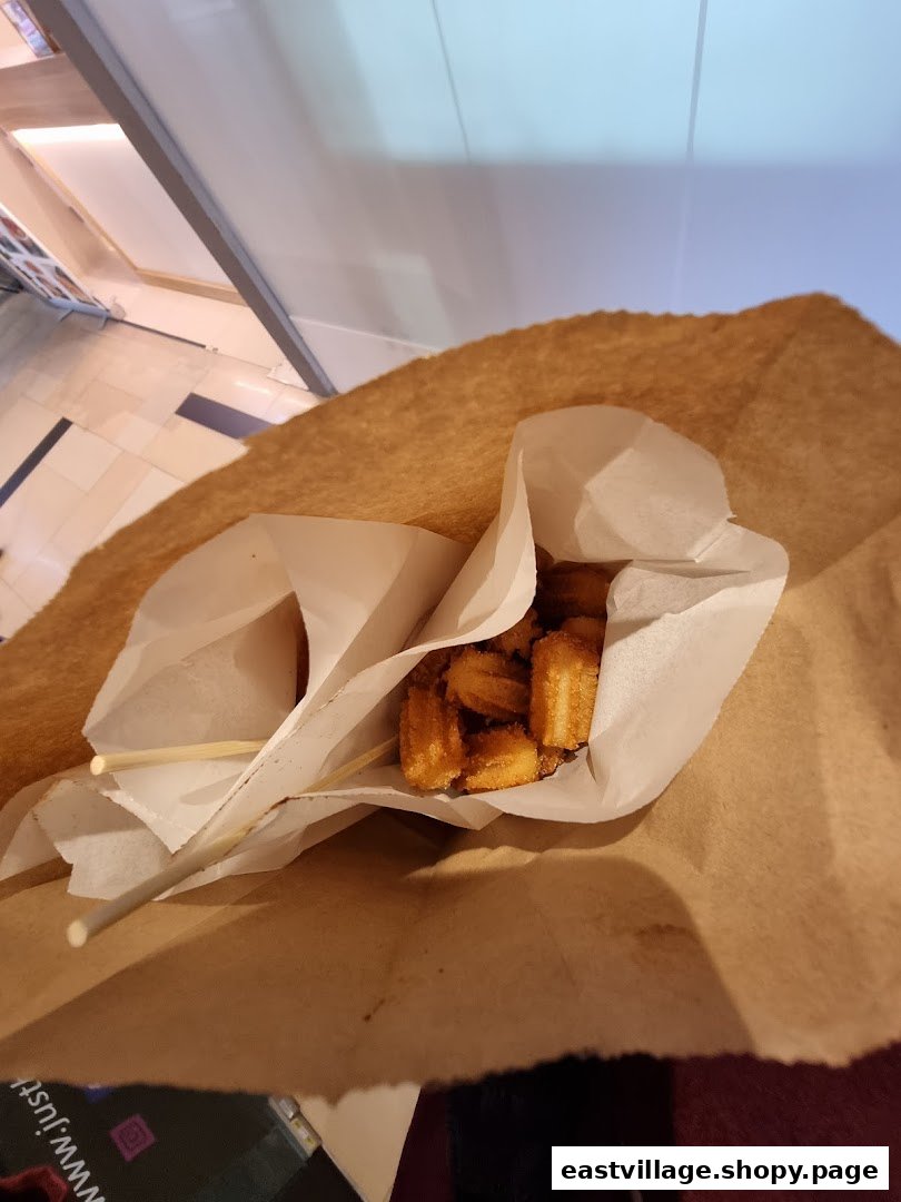Golden churros served in a paper bag, ready to enjoy from Chulop! by The Syarifs.