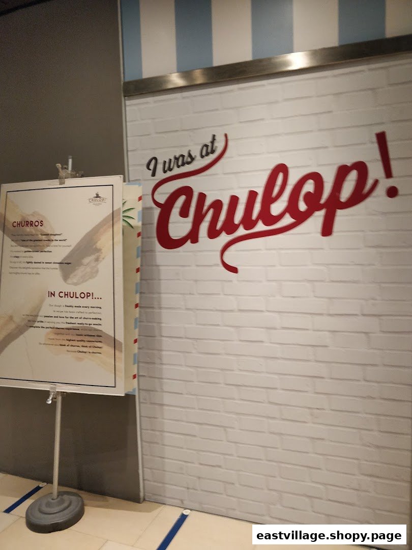 Entrance to Chulop! by The Syarifs featuring a 'I was at Chulop!' sign and a churros information standee.