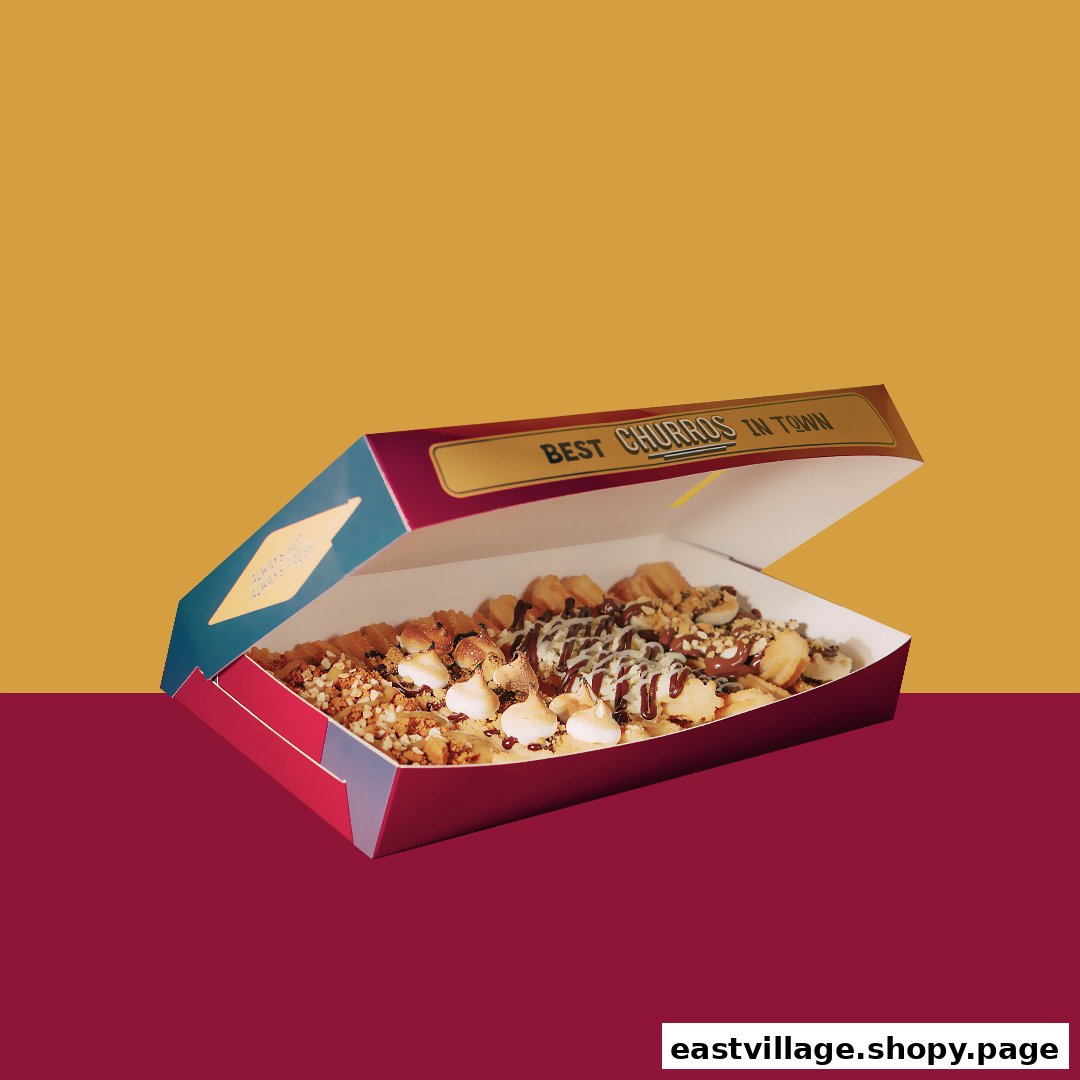 A vibrant image showcasing a box of delicious churros with various toppings, ready to be enjoyed.