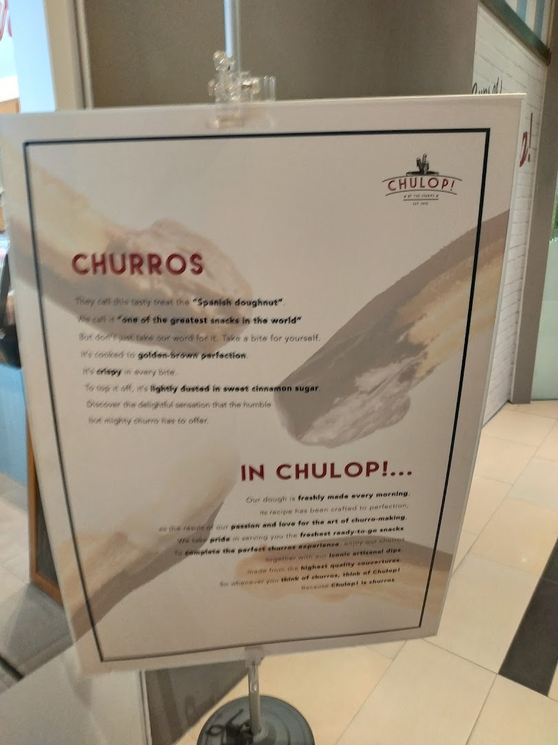 A promotional standee for Chulop! by The Syarifs, detailing the appeal of their churros.
