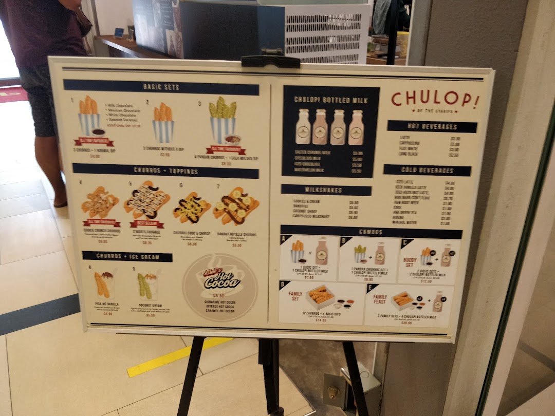 A vibrant menu board for Chulop! by The Syarifs, showcasing churros, drinks, and combos.