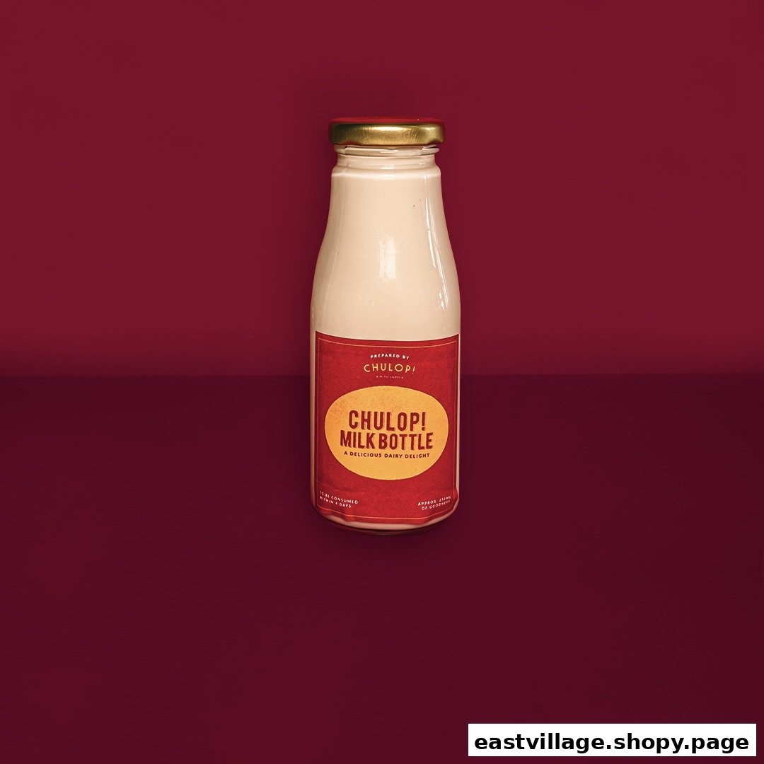 A Chulop! Milk Bottle, a delicious dairy delight, stands against a rich red background.