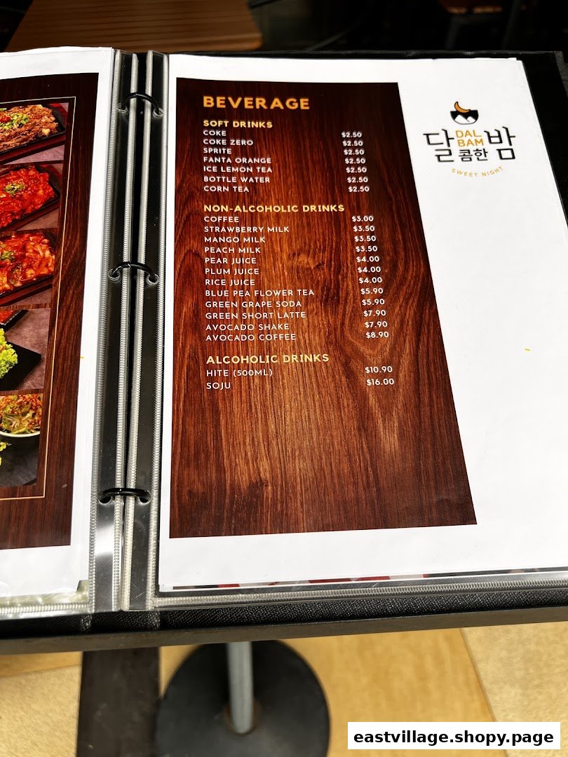 A page from Dalcomhan Bam Korean Restaurant's beverage menu, featuring soft drinks, non-alcoholic, and alcoholic options.