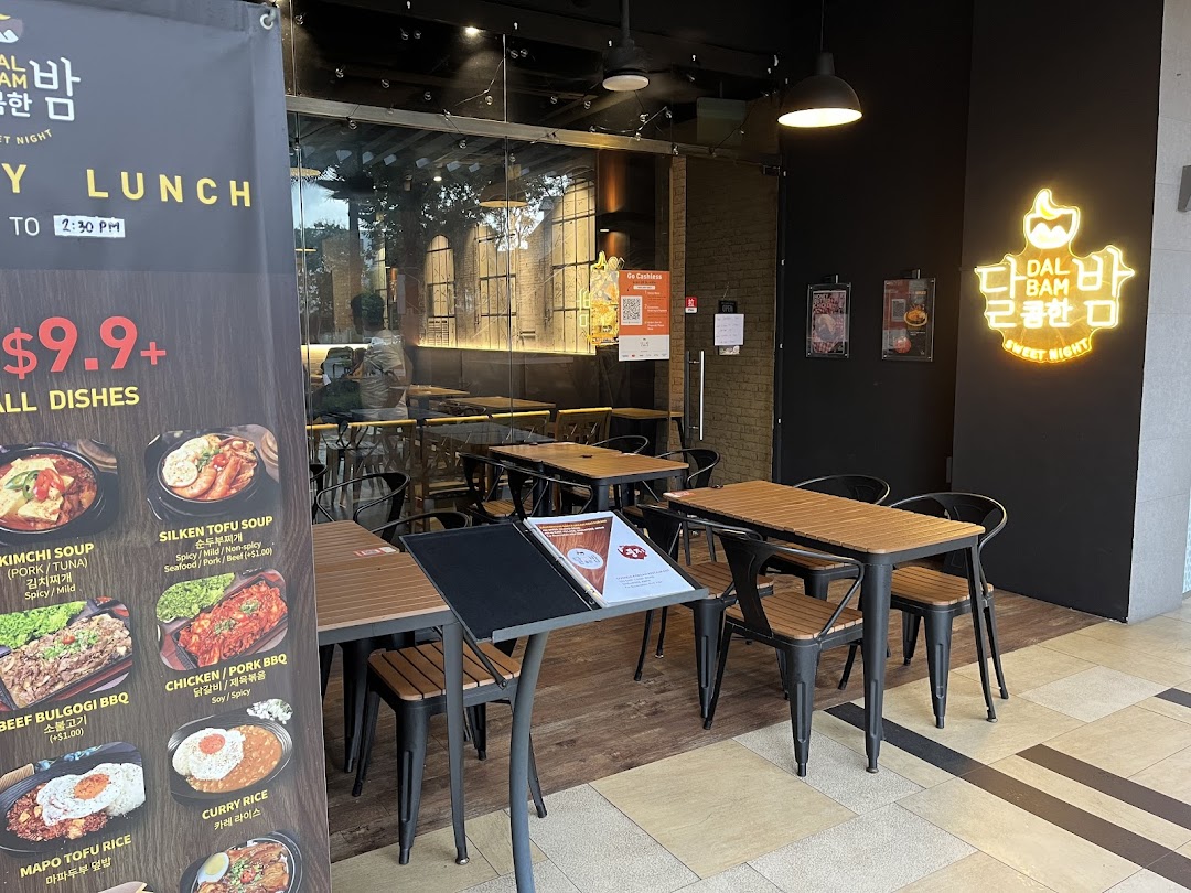 Exterior view of Dalcomhan Bam Korean Restaurant featuring a prominent lunch menu banner and outdoor seating.