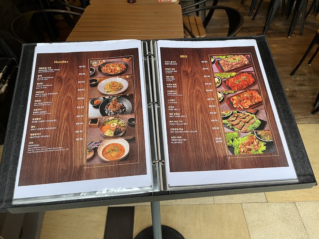 A detailed menu displaying various Korean noodle and BBQ dishes with prices and images.