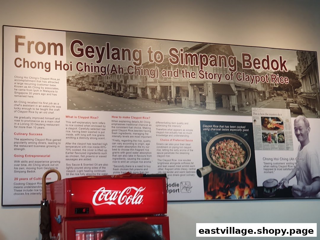 A large wall display detailing the history of Chong Hoi Ching (Ah Ching) and the traditional preparation of Claypot Rice.