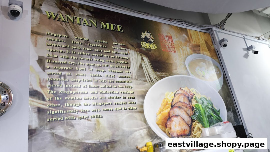 A large poster explaining Wantan Mee, featuring a delicious image of the noodle dish.