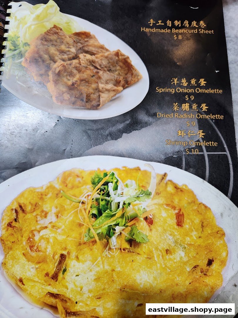 A menu page showcasing various omelette dishes and a handmade beancurd sheet with prices.