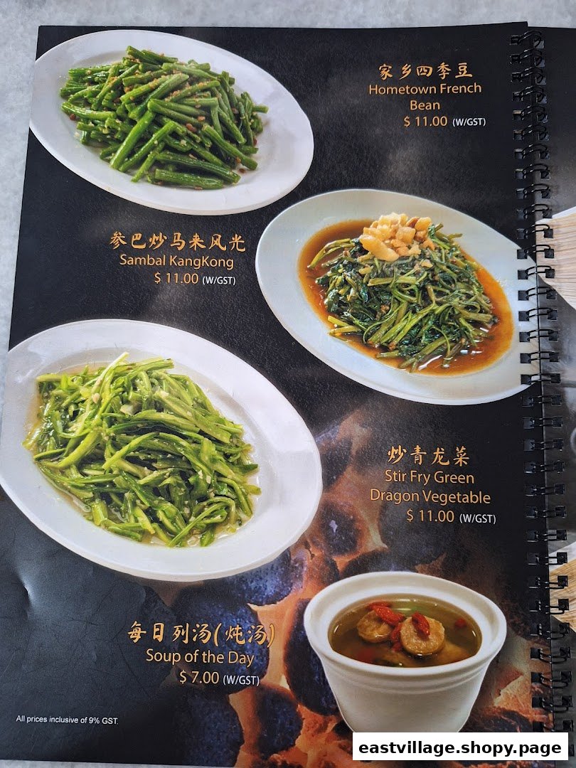 A menu page showcasing various vegetable dishes and a comforting soup with prices.