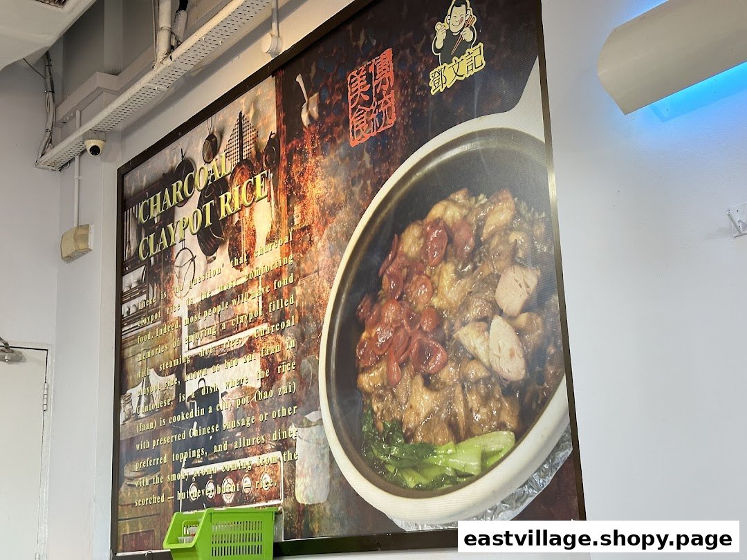 A large promotional poster for Charcoal Claypot Rice, featuring an image of the dish and descriptive text.