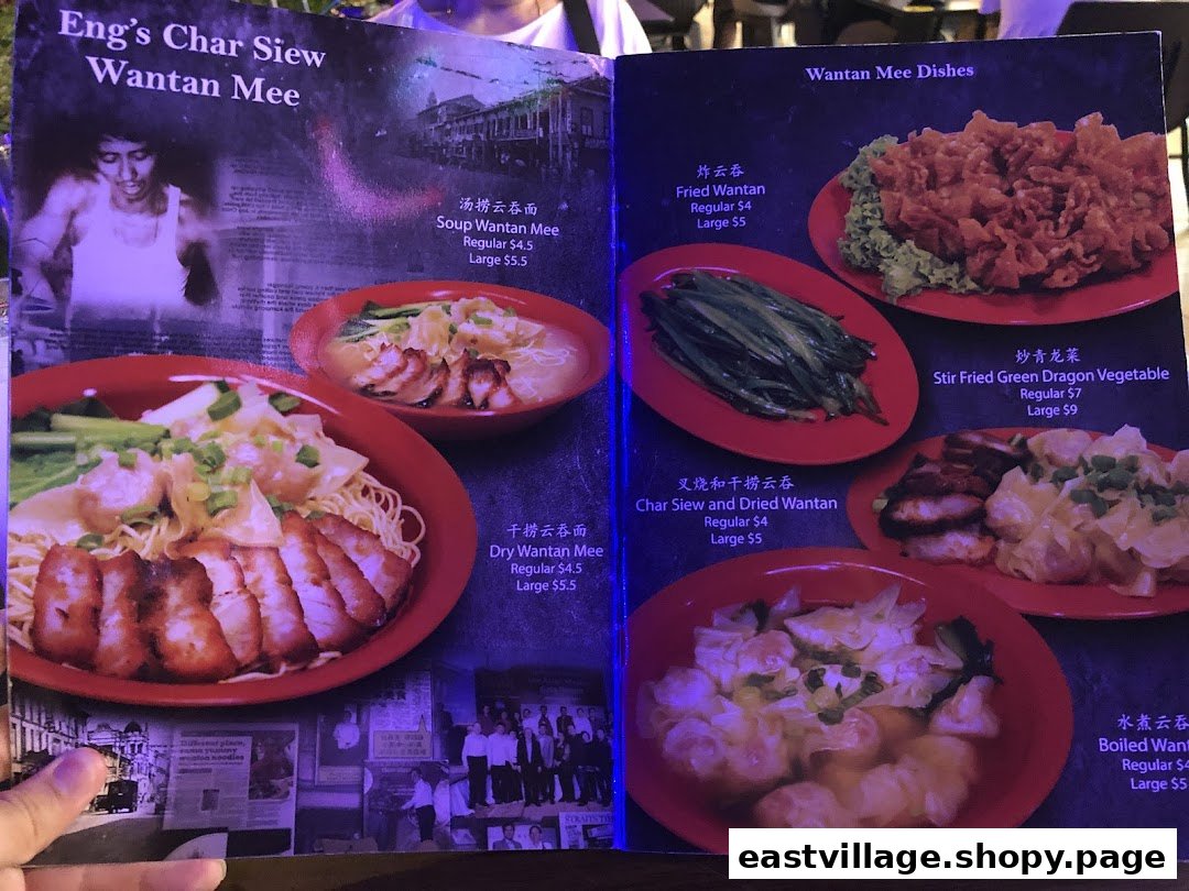 A vibrant menu displaying various Wantan Mee dishes and sides with prices.