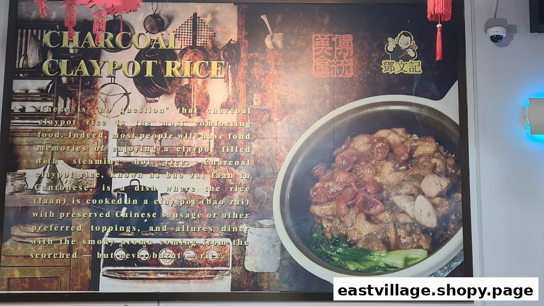 A large promotional poster for Deng Wen Ji's signature Charcoal Claypot Rice, featuring the dish and descriptive text.