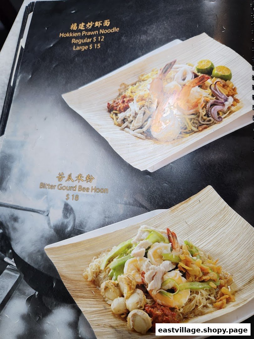 A menu page displaying Hokkien Prawn Noodle and Bitter Gourd Bee Hoon with prices and images.