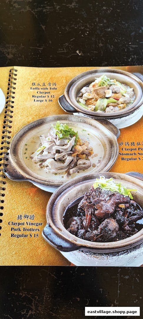 A close-up of a menu page displaying various claypot dishes with their names, descriptions, and prices.