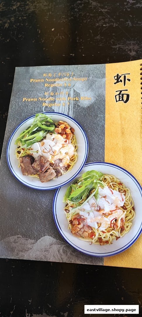 A close-up of a menu page featuring two types of prawn noodles with accompanying images.