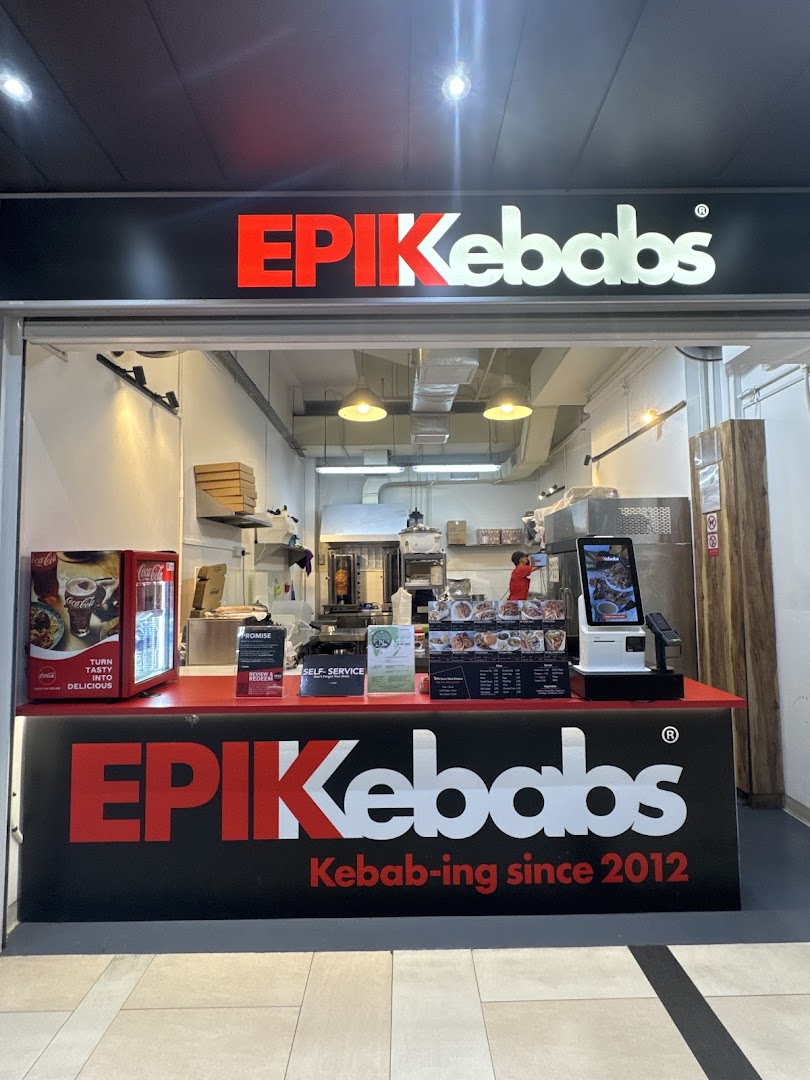 The storefront of EPIKebabs East Village, featuring its prominent red and white logo and counter.