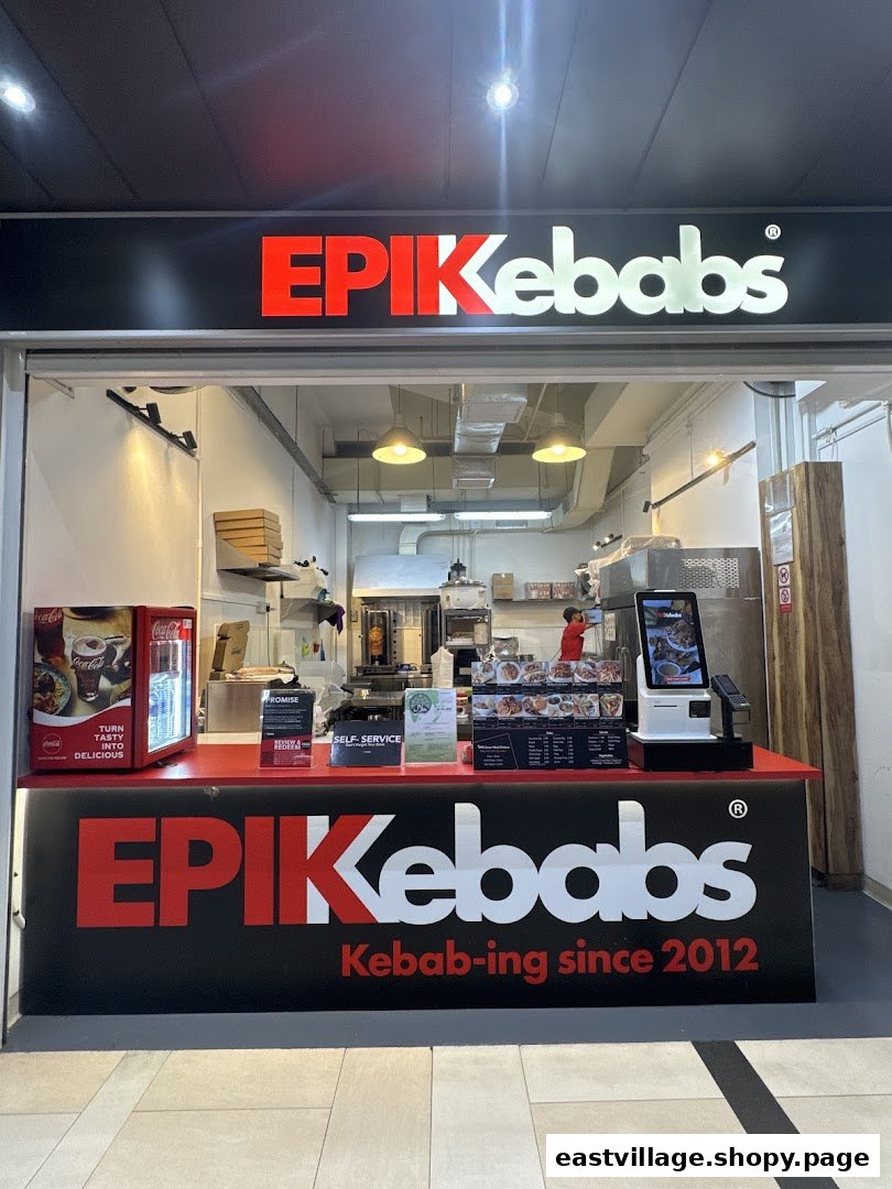 The storefront of EPIKebabs East Village, featuring its prominent red and white logo and counter.