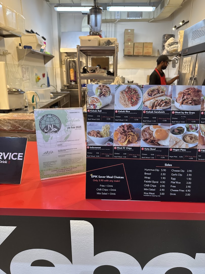 A view of the EPIKebabs counter with a menu board and kitchen in the background.