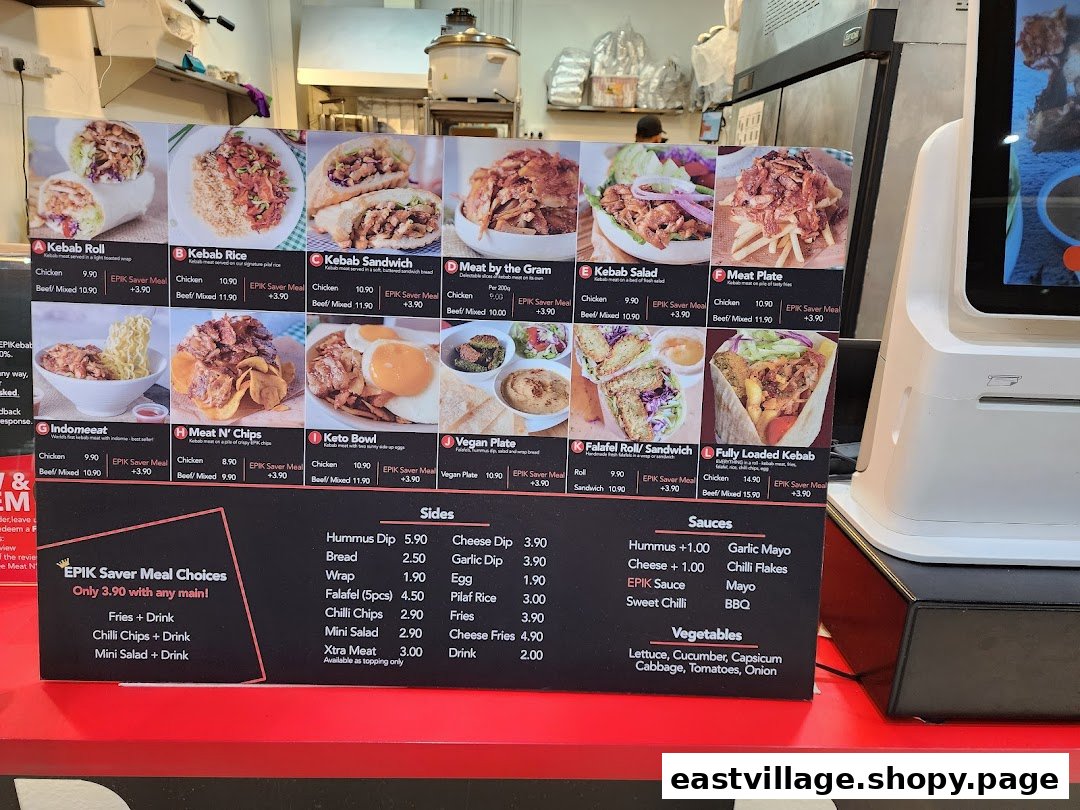 A vibrant menu board displaying various kebab dishes with prices and meal options.