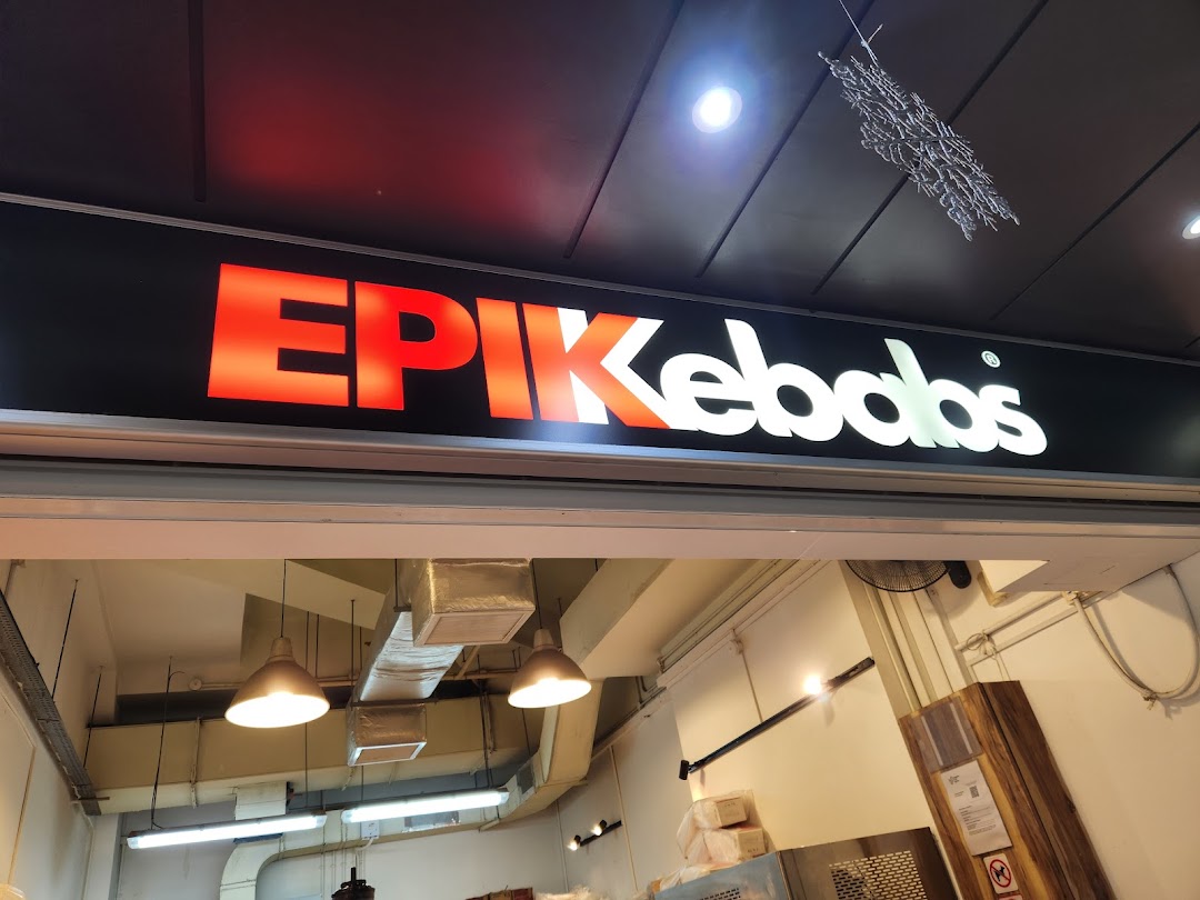 A bright, illuminated sign for 'EPIKebabs' above the shop entrance.