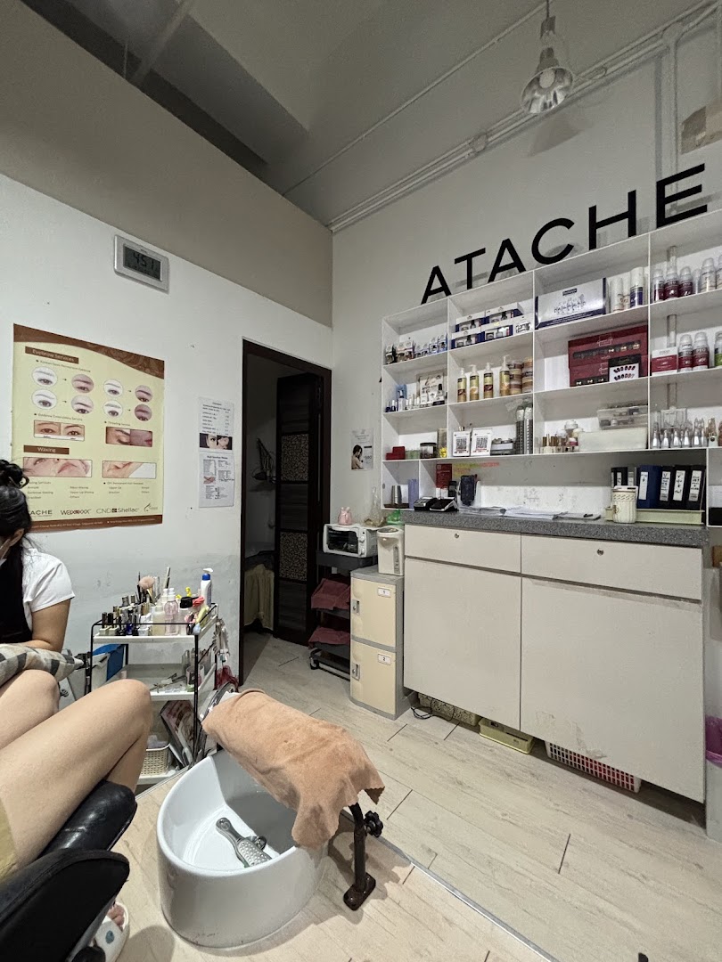 Interior view of Esther Beauty Center showing a pedicure station, product display, and a client.