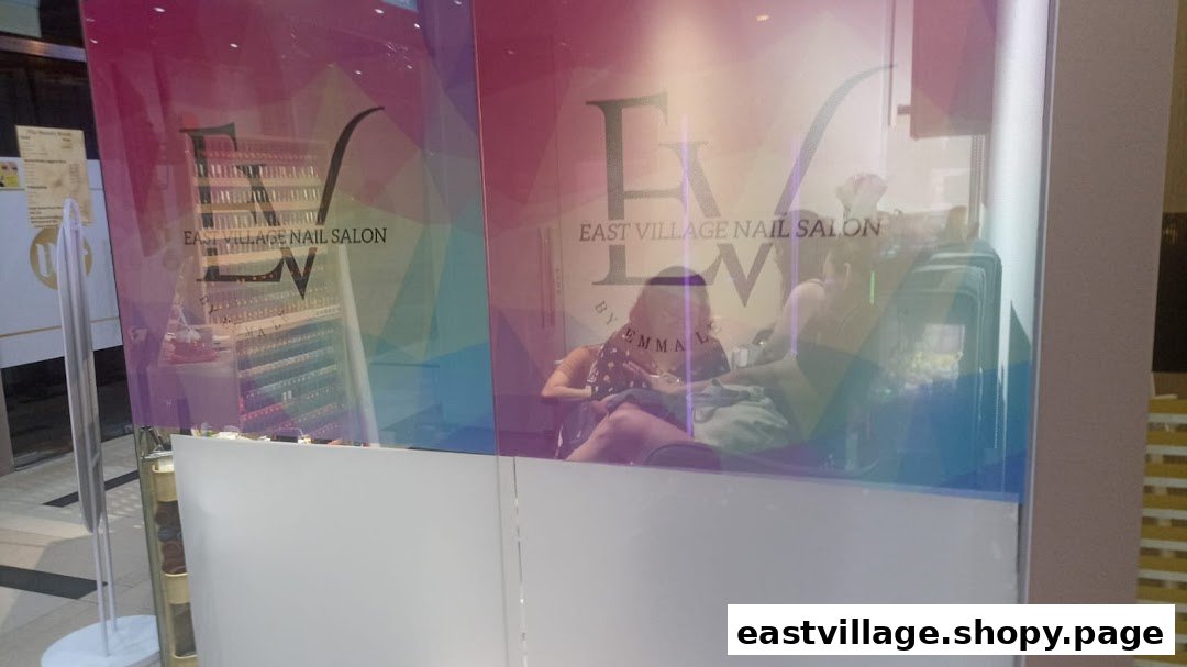 The vibrant storefront of EV Nail Salon, showcasing customers enjoying services inside.