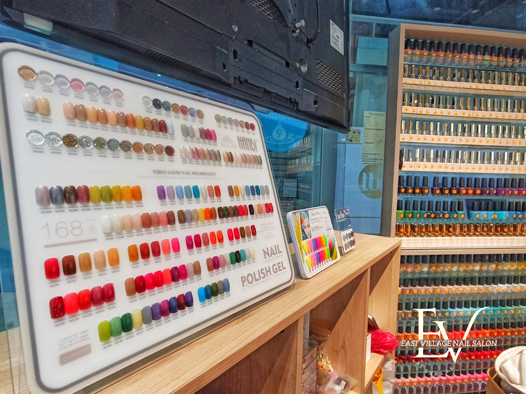 A vibrant display of numerous nail polish colors and gel options inside EV Nail Salon.