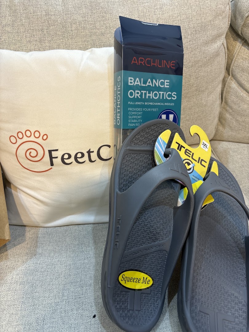 FeetCare branded pillow, Archline Balance Orthotics, and Telic sandals, showcasing specialized foot comfort products.