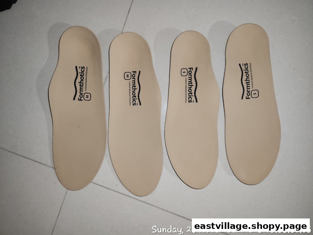 Four pairs of Formthotics custom medical orthotics insoles are displayed on a tiled surface.