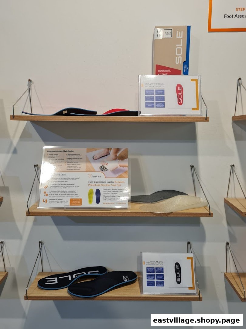Shelves displaying various insoles and informational signs about custom foot care solutions at FeetCare.