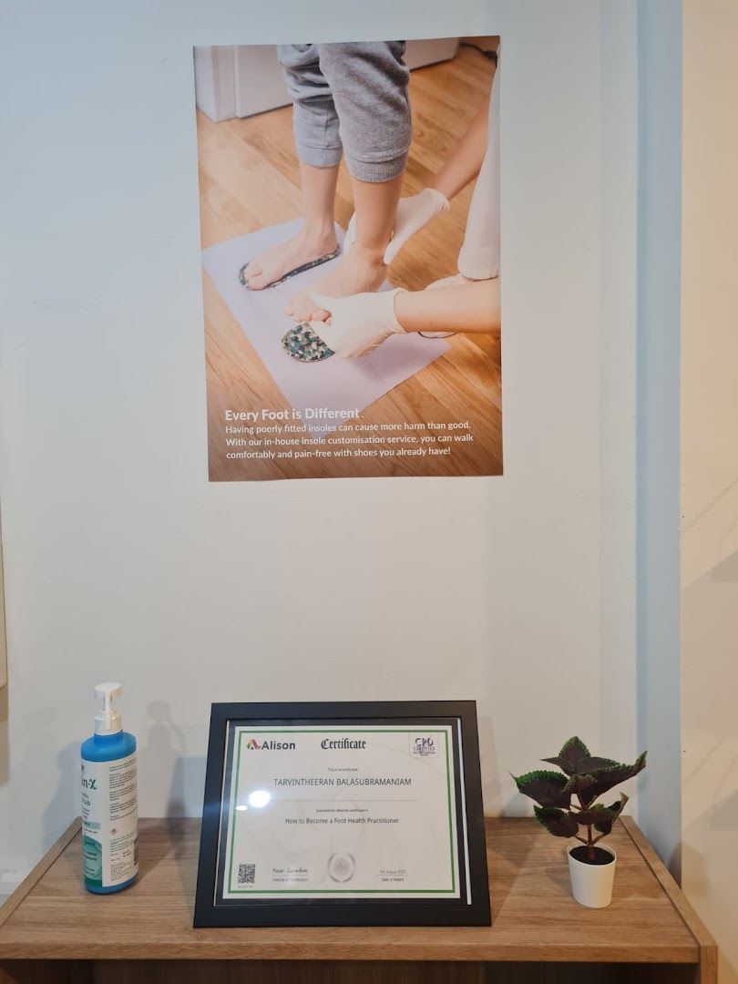 An interior shot featuring a poster about custom insoles and a foot health practitioner certificate.