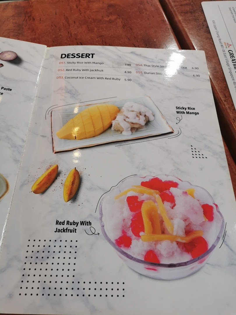 A close-up of GreaThai's dessert menu featuring traditional Thai sweets like Sticky Rice with Mango and Red Ruby with Jackfruit.