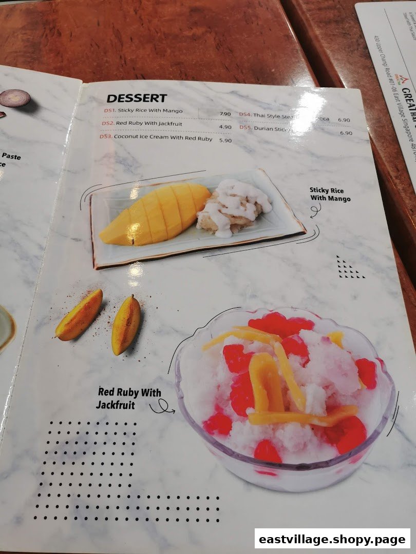 A close-up of GreaThai's dessert menu featuring traditional Thai sweets like Sticky Rice with Mango and Red Ruby with Jackfruit.
