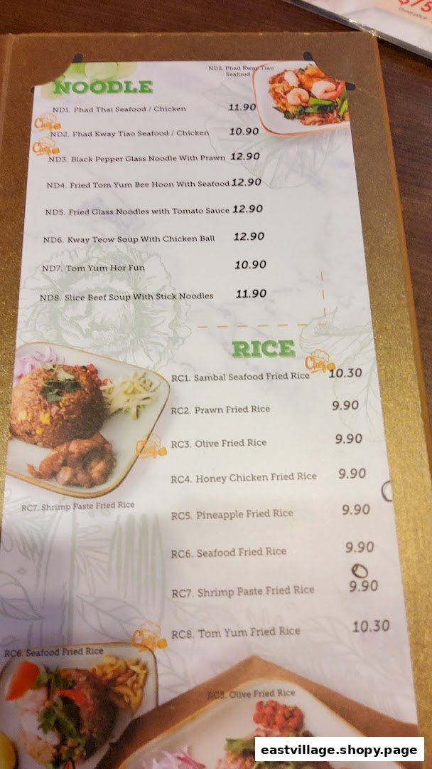 A close-up view of GreaThai's menu, showcasing noodle and rice dishes with prices.