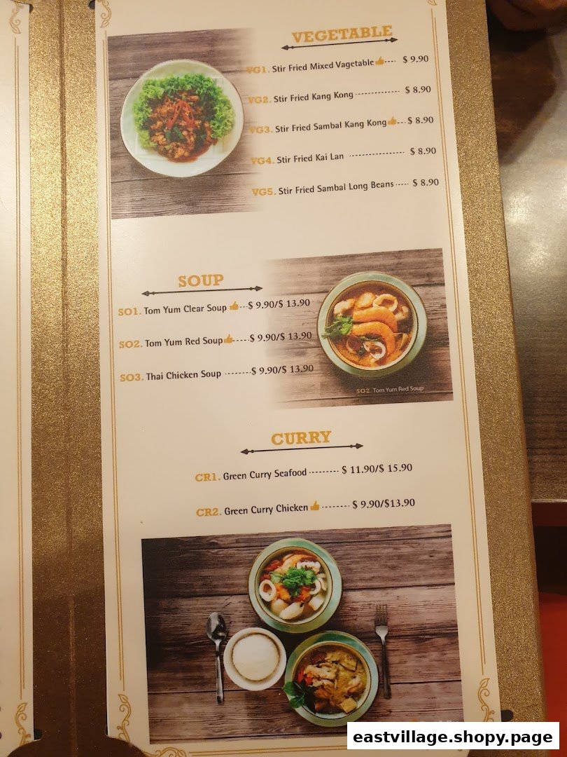 A detailed menu page from GreaThai, showcasing vegetable, soup, and curry dishes with prices.
